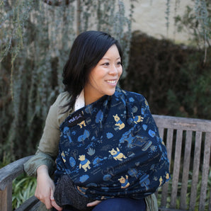 A woman smiles on a bench with Milk Snobs Cover Disneys Winnie the Pooh, surrounded by lush greenery.