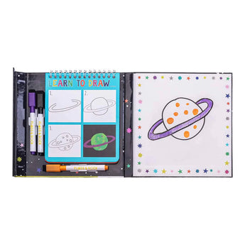 Floss and Rocks Learn to Draw, Space kit includes a reusable drawing guide with markers for creating a planet-themed masterpiece.