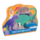 The 80 Piece Dinosaur Puzzle by Floss and Rock features colorful dinos, plants, rocks on a vibrant orange box labeled Dino Den.