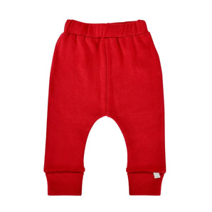 Finn and Emmas Organic Cotton Pants in Scarlet Red feature an elastic waistband and cuffed ankles, shown on a white background.