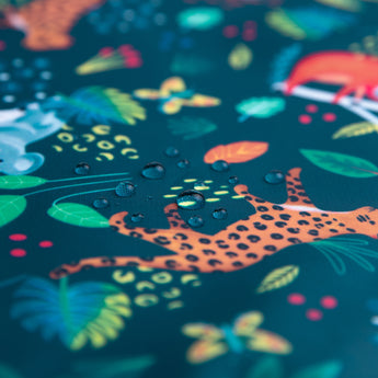 Close-up of water droplets on a Bumkins Wet Bag 2 Pack: Jungle + Animal Prints.