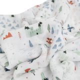Little Unicorns Bamboo Swaddle, Dragon Days, features whimsical pastel castles, dragons, and trees on softly crumpled rayon muslin.
