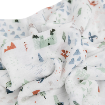 Little Unicorns Bamboo Swaddle, Dragon Days, features whimsical pastel castles, dragons, and trees on softly crumpled rayon muslin.