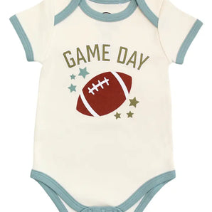 Emerson and Friends Luxury Bodysuit features Game Day text, football graphics, stars, and teal trim—a sporty print for babies.