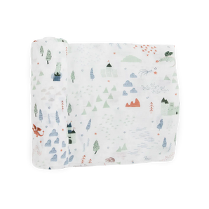 Little Unicorns Bamboo Swaddle, Dragon Days, features a soft rayon muslin with mountains, trees, castles, clouds & a red dragon.