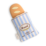 Baguette Teensy Crinkle: tan silicone bread toy and blue & cream striped fabric pouch; text "Bread Traditional French Bakery Paris London Rome."