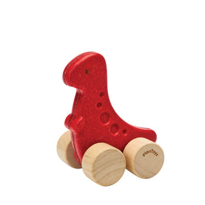 Dino Car, Rex: red ruberwood dinosaur toy with tan wheels with PlanToys logo.
