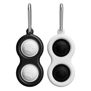 The Simpl Dimpl by Fat Brain Toy Co features two black and white double-sided key tags with brain logos, each on a metal ring.