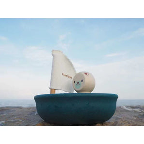 Sailing Boat, Polar Bear by PlanToys: A toy sailboat featuring a smiling bear and fabric sail. Enjoy sustainable play!.