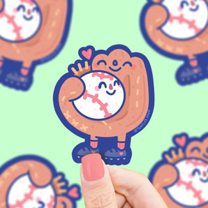Turtle Soups Vinyl Sticker features a cartoon glove hugging a smiling baseball on light green—perfect for any baseball lover.
