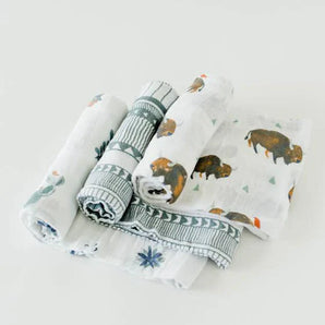 The Little Unicorn Cotton Swaddle Set, Bison, includes 4 breathable muslin blankets with bison, cactus, and geometric designs.