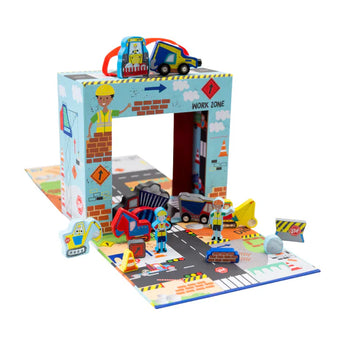 Floss and Rocks Play Box with Wooden Pieces: a construction-themed set featuring vehicles, workers, and road signs on a foldable mat.