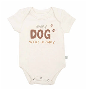 Organic Bodysuit,  Every Dog Needs a Baby: white short sleeve bodysuit with text "Every Dog Needs A Baby." Made of 100% organic cotton.