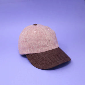Storied Hats Lil Hat, Jam is a hemp-based two-tone cap with a pink crown and brown brim.
