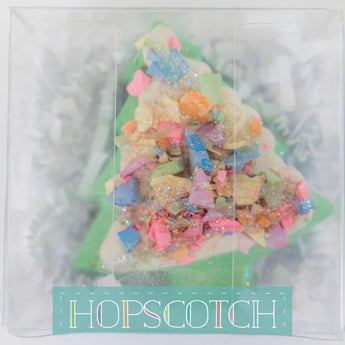 Festive Sidewalk Chalk in a Christmas tree shape with bright colors and sprinkles, packaged by Hopscotch.
