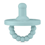 The Round Pacifier and Teether, Seaside by Ryan & Rose is teal, made from medical-grade silicone, and features a beaded ring handle.