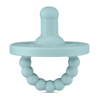 The Round Pacifier and Teether, Seaside by Ryan & Rose is teal, made from medical-grade silicone, and features a beaded ring handle.