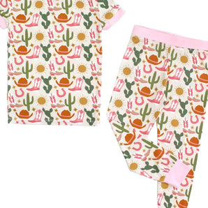 Emerson and Friends PJs, Hey Yall: bamboo baby pajamas with pink trim and a wildlife print of cacti, cowboy hats, boots & suns.