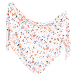 Horizontal display of Copper Pearls Knit Swaddle Blanket, Mickey Mouses Boo Bash with fall-themed prints.
