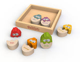 Color N Eggs features wooden owl puzzles with English/Spanish colors. Includes a Begin Again tray to enrich language learning.