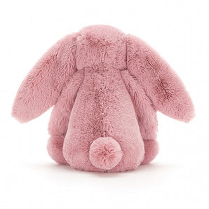 A Jellycat Bashful Tulip Bunny Medium toy, soft with nuzzly ears and a fluffy tail, meets the European Safety Standard.