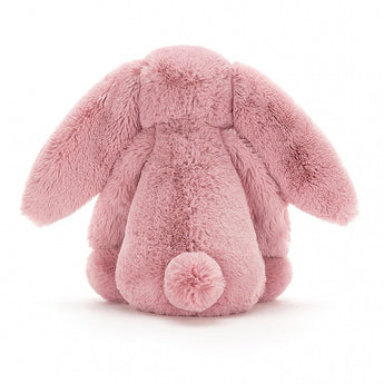 A Jellycat Bashful Tulip Bunny Medium toy, soft with nuzzly ears and a fluffy tail, meets the European Safety Standard.