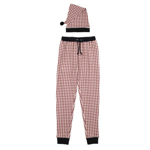 The Lovedbaby Adult Holiday Jogger & Cap in Crimson Plaid features black cuffs and waistband, paired with a Santa hat with black pom-pom.