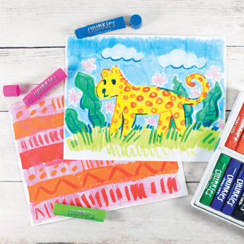 A childs colorful drawings of a yellow animal in grass with abstract designs, using vibrant Chunkies Paint Sticks by OOLY.