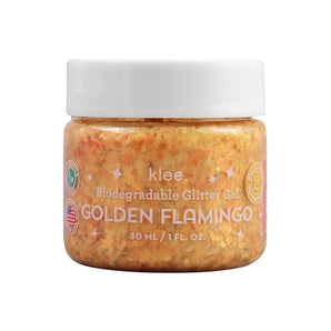 Golden glitter gel jar labeled Klee Naturals Biodegradable Glitter Gel Golden Flamingo, 30 ml/1 oz, with eco-friendly symbols.