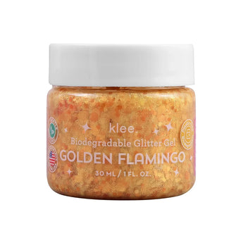 Golden glitter gel jar labeled Klee Naturals Biodegradable Glitter Gel Golden Flamingo, 30 ml/1 oz, with eco-friendly symbols.