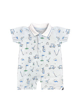 The Noomie Golf Romper features clubs, carts, and flags on a pale base with blue and green accents in Pima cotton.