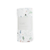 Little Unicorns Bamboo Swaddle, Dragon Days: a deluxe rayon muslin with trees and tents, rolled with a white center label.