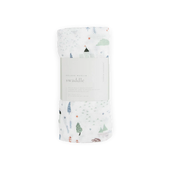 Little Unicorns Bamboo Swaddle, Dragon Days: a deluxe rayon muslin with trees and tents, rolled with a white center label.