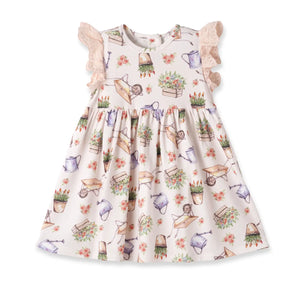 Dress, Eyelet Garden: beige dress with eyelet ruffle sleeves with watering can, wheelbarrow, and flower pattern.
