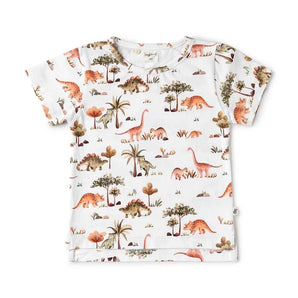 Check out Snuggle Hunnys Organic T-Shirt, Dinos—a white childrens tee with certified organic cotton and a vibrant dinosaur print!.