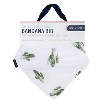 Bebe Au Laits Bandana Bib, Saguaro: white muslin, bamboo-cotton blend with green cactus print, label and dark blue hanging strap.