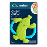Chew Crew Pickle: green silicone pickle teether with blue handles attached to dark blue card with Itzy Ritzy logo and text "Chew Crew."