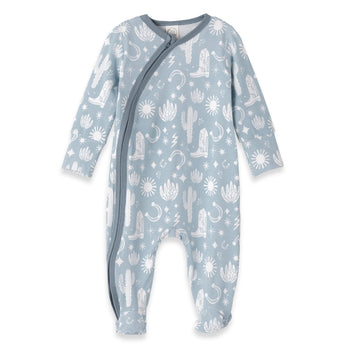 The Tesa Babe Wild West Blue Romper is a wrap-style onesie with white desert-themed cowboy prints.