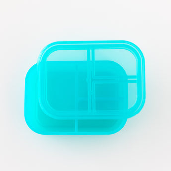 Top down view of Bumkins Silicone Bento Box 3 Section: Blue Jelly on a white background.