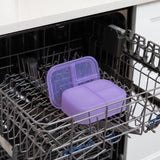 A bento box and lid from Bumkins Lunchbox Legends 6-Piece Set: Unicorns Purple Jelly sit in the top rack of an open dishwasher.