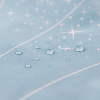 Close-up of water droplets on Bumkins Ruffle Apron Bib: Cinderella.