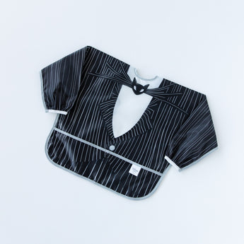 A bib from Bumkins Snack In Character 3-Piece Set: Disney Everyday Is Halloween Jack lays flat on a white background.