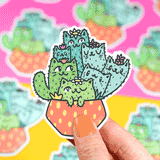 Turtle Soups Vinyl Sticker, Cactus Cats: Cute cat-shaped cacti in an orange polka dot pot held by peach-nail hand. Premium vinyl.