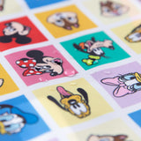 Close-up of water droplets on Bumkins Sleeved Bib: Mickey & Friends Check Mates.