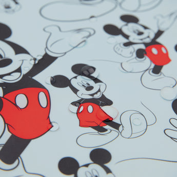 The Splat Mat: Mickey Mouse by Bumkins has illustrated characters in red shorts and gloves, on a white backdrop—perfect for kids messes.