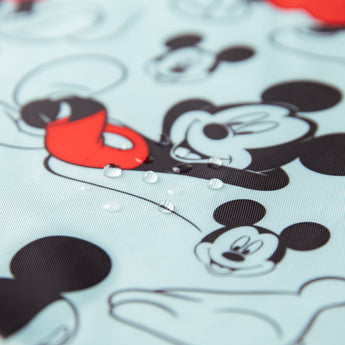 Close-up of water droplets on Bumkins Short-Sleeved Smock: Mickey Mouse Classic.
