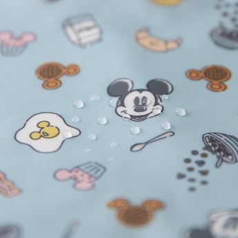 Close-up of water droplets on a Bumkins On-The-Go Mealtime 5-Piece Set: Mickey + Minnie Mouse Sunny Side Up Pink.
