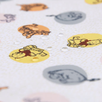Close-up of water droplets on a Bumkins The Chaos Coordinator Essential 4-Piece Set: Disney Winnie + Friends.