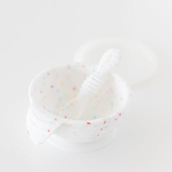 Bumkins Silicone First Feeding Set: Vanilla Sprinkle is displayed on a white background.