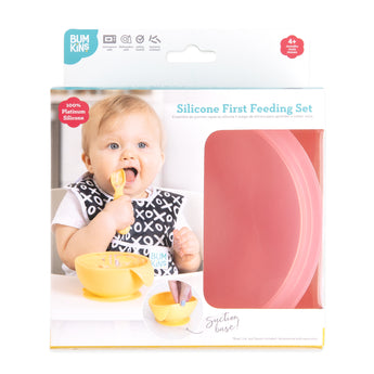 Bumkins Silicone First Feeding Set: Pink Jelly is shown in a white packaging box, with a clear window partially showing the bowl.